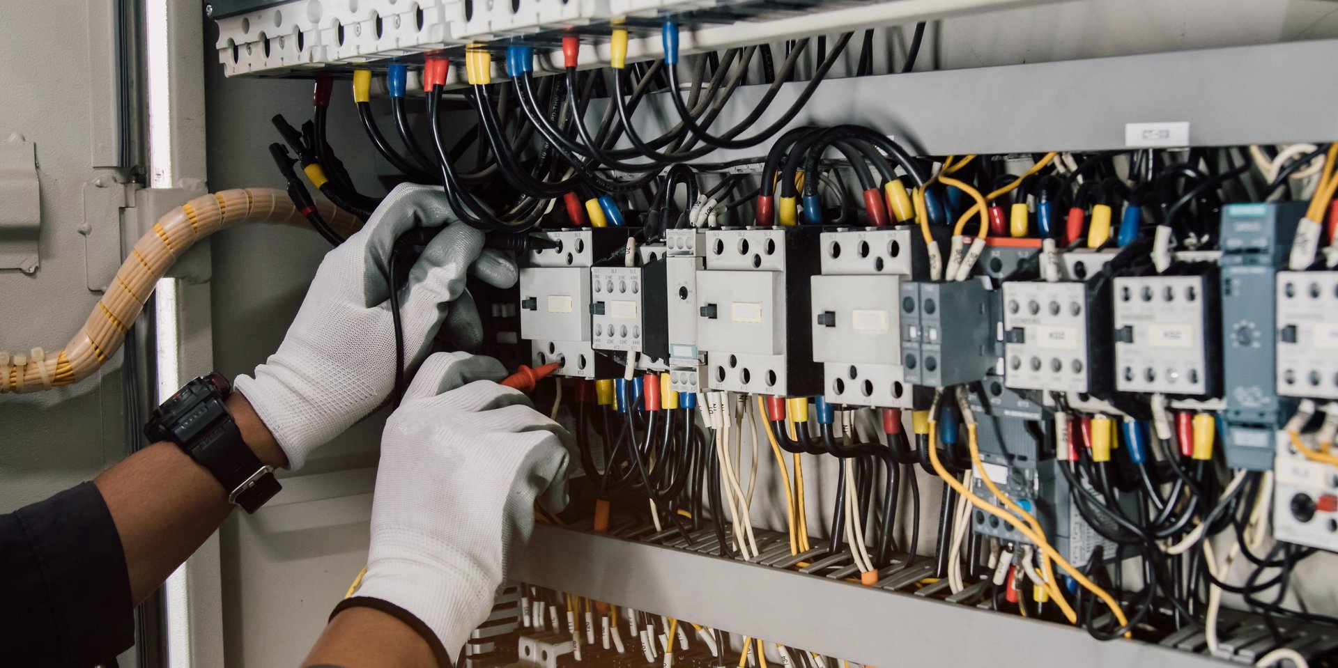 Professional electrician testing electrical installations